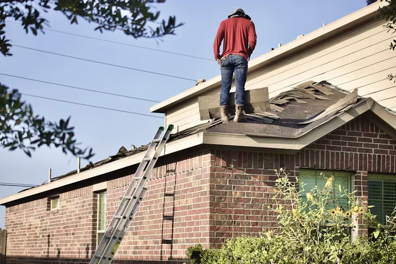 Professional roofer working on a residential roof in Hoffman Estates